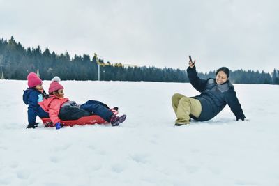 Woman and son on field during winter