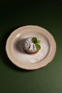 High angle view of food in plate against black background