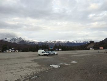 Scenic view of mountains against cloudy sky