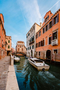 White-colored motorboat as it sails the canals of venice