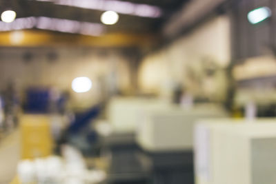 Defocused image of illuminated lights on table