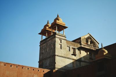 Low angle view of church against blue sky