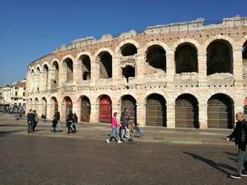 People in front of historical building