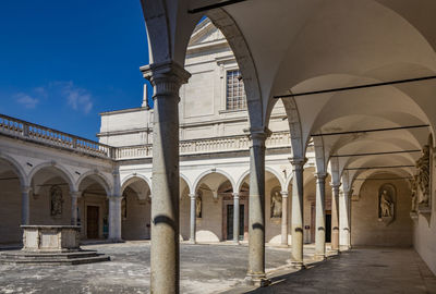 Corridor of historic building against sky