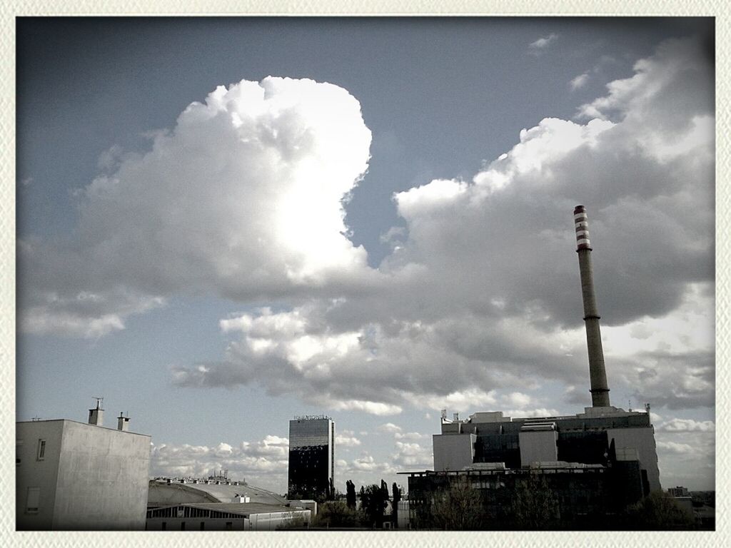 transfer print, building exterior, architecture, built structure, sky, auto post production filter, city, cloud - sky, tower, low angle view, tall - high, cloudy, cloud, skyscraper, cityscape, tall, outdoors, day, travel destinations, capital cities