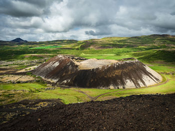 View of landscape against cloudy sky