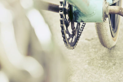 Close-up of bicycle wheel on road