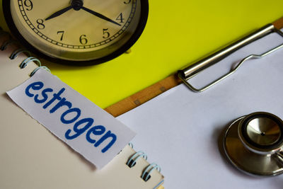 High angle view of clock on table
