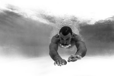 Close-up of man swimming in pool