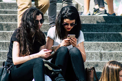 Friends sitting on mobile phone