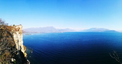 Scenic view of sea against blue sky