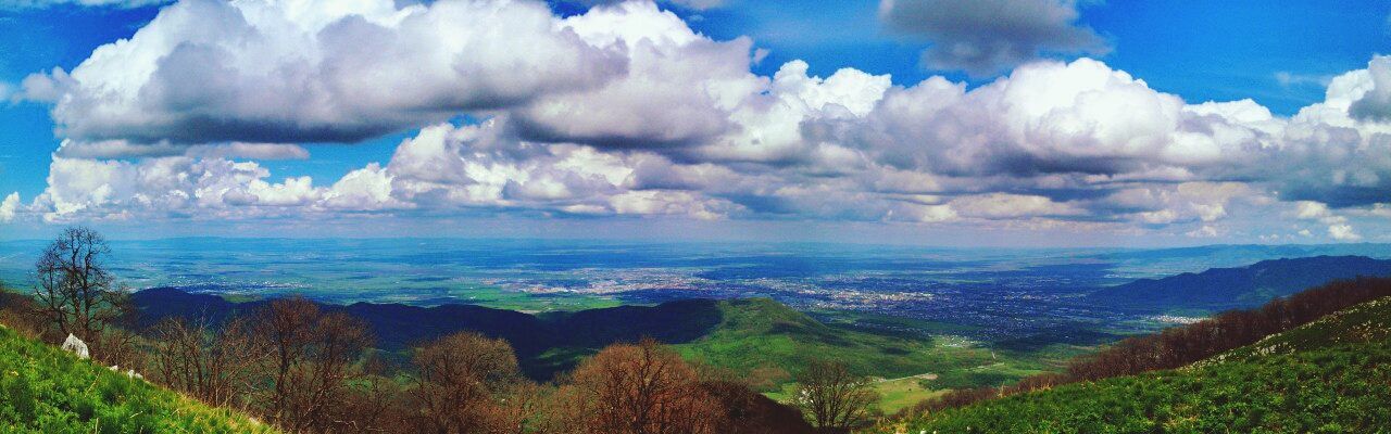 tranquil scene, scenics, sky, tranquility, beauty in nature, mountain, landscape, cloud - sky, nature, blue, cloud, mountain range, idyllic, non-urban scene, cloudy, panoramic, sea, water, remote, high angle view