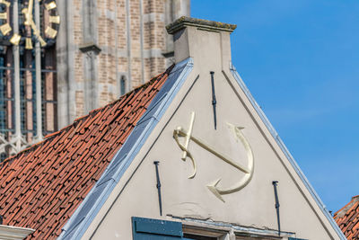 Low angle view of building against blue sky