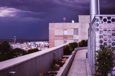 Street amidst buildings against sky