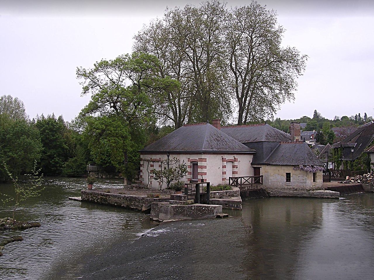 water, built structure, architecture, building exterior, tranquility, sky, tree, outdoors, nature, day, natural disaster, no people, extreme weather