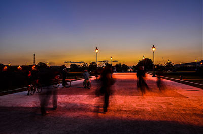 People walking on road at night