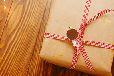 High angle view of paper tied up on table