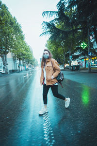 Man with umbrella on street in city