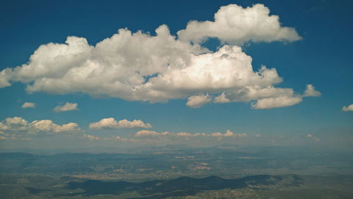 Scenic view of landscape against cloudy sky