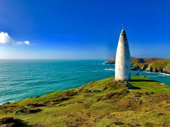 Scenic view of sea against clear blue sky