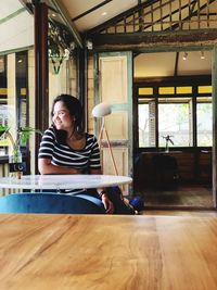 Woman sitting at restaurant