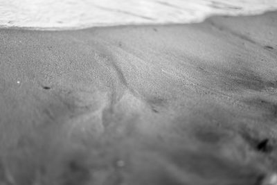 Close-up of sand at beach