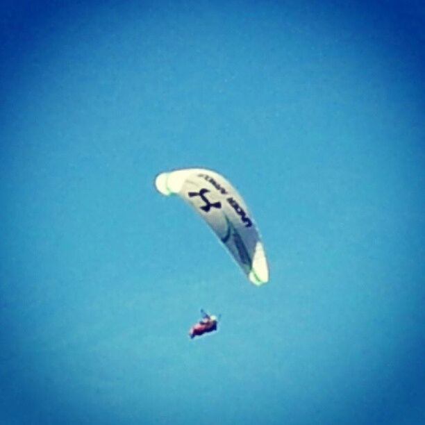 flying, blue, mid-air, air vehicle, low angle view, transportation, airplane, clear sky, copy space, mode of transport, on the move, travel, parachute, journey, motion, day, adventure, freedom, outdoors, exhilaration