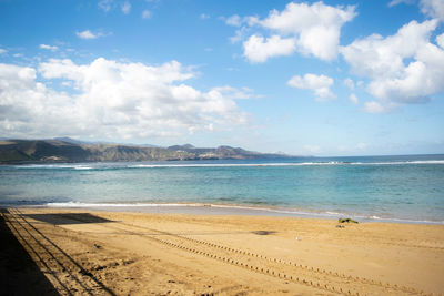 Scenic view of beach against sky