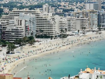 High angle view of buildings by sea