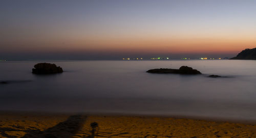 Scenic view of sea against sky at sunset