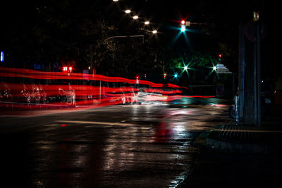 Light trails on road in city at night