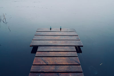 High angle view of wooden jetty by sea