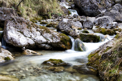 Stream flowing through rocks in forest