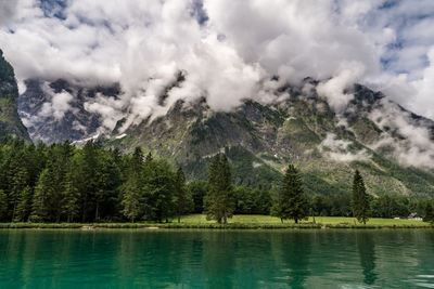 Scenic view of lake and mountains against sky