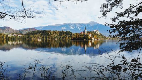 Scenic view of lake and mountains against sky