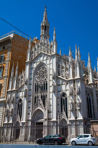 Low angle view of buildings against sky in city