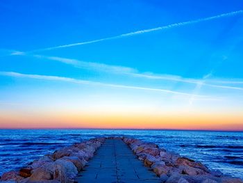 Scenic view of sea against blue sky