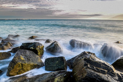 Scenic view of sea at dusk