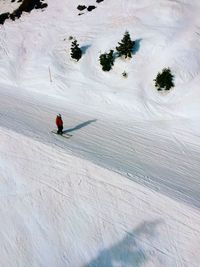 High angle view of person skiing on snow covered mountain