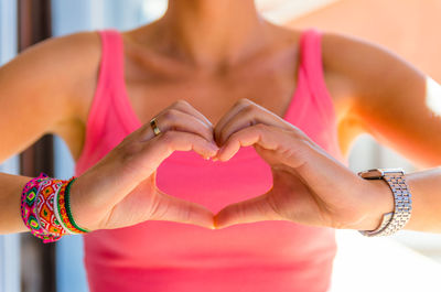 Close-up of hand holding heart shape