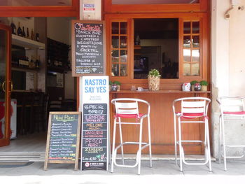 Empty chairs and tables in restaurant