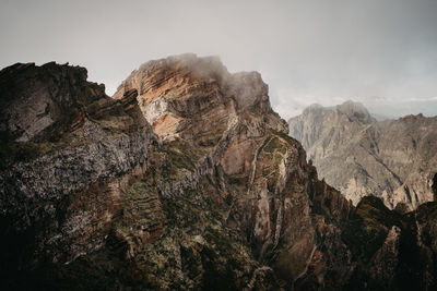 Panoramic view of rock formations against sky