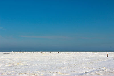 Scenic view of sea against blue sky