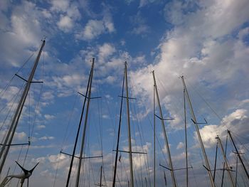 Low angle view of sailboat against blue sky