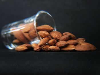 Close-up of roasted coffee beans against black background