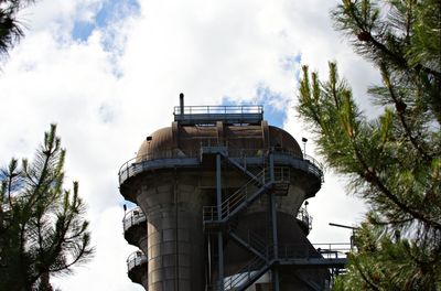 Low angle view of silo against sky