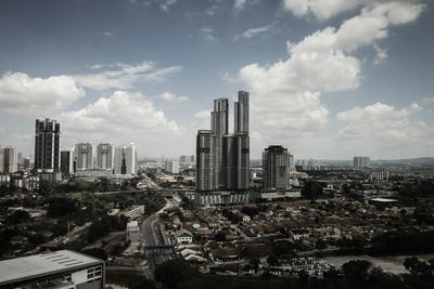 High angle view of buildings in city against sky