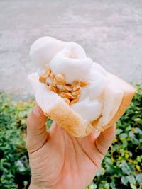 Close-up of hand holding ice cream