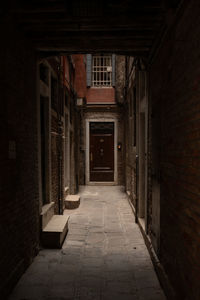 Empty alley amidst buildings