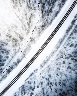 High angle view of snow covered car against sky